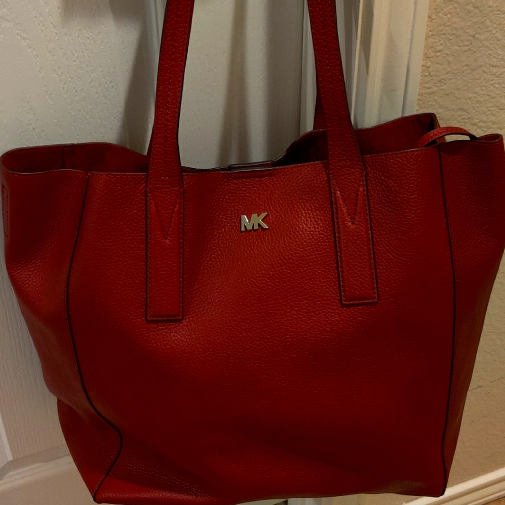Michael Kors, large, unlined leather tote in burgundy.